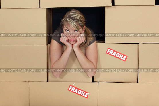 Woman surrounded by boxes. Стоковое фото, агентство Ingram Publishing / Фотобанк Лори