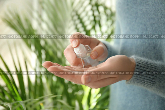 Woman using antibacterial hand sanitizer, closeup. Стоковое фото, фотограф Pixel_shot / Фотобанк Лори