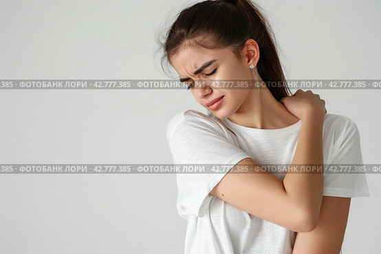 Woman with pain in shoulder, upper arm. Human body health problem banner. Female person is enduring awful ache. Upset lady with muscle, nerve pain symptoms holding a hand on painful zone injured point. Стоковое AI-изображение, AI-художник Марина Демидюк / Фотобанк Лори
