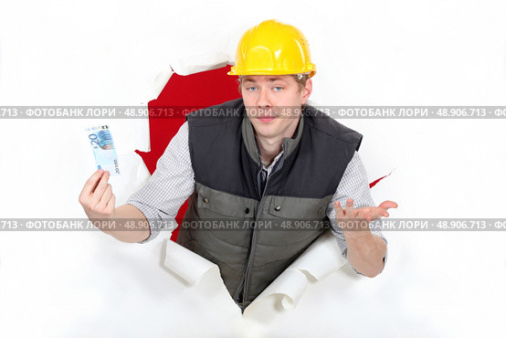 Workers coming out of torn paper hole with ticket in hand. Стоковое фото, агентство Ingram Publishing / Фотобанк Лори