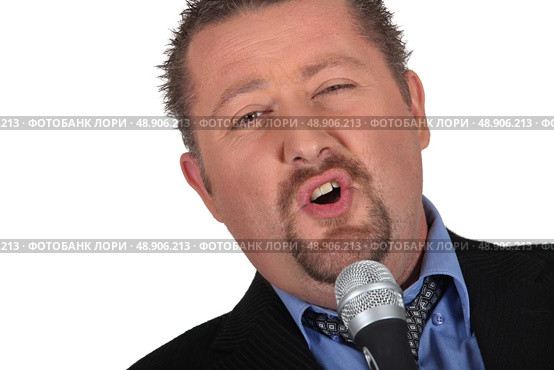 would be male singer with microphone. Стоковое фото, агентство Ingram Publishing / Фотобанк Лори