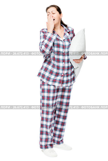 Yawning sleepy woman in warm pajamas holds ready pillow on white background isolated. Стоковое фото, фотограф Константин Лабунский / Фотобанк Лори