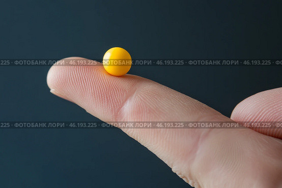 Yellow ball balanced on a fingertip against a dark background during daylight. Стоковое AI-изображение, AI-художник Юлия Гапеенко / Фотобанк Лори