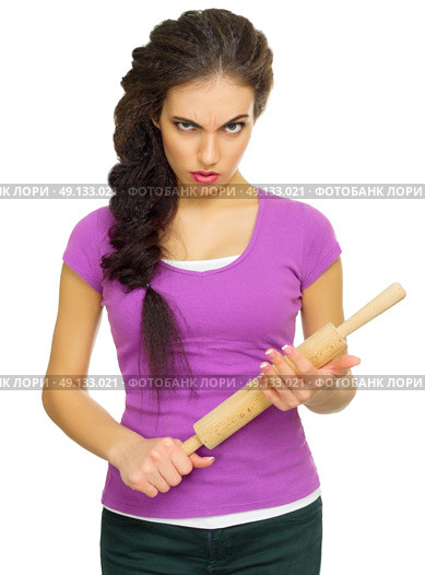 Young angry woman the chef isolated. Стоковое фото, агентство Ingram Publishing / Фотобанк Лори