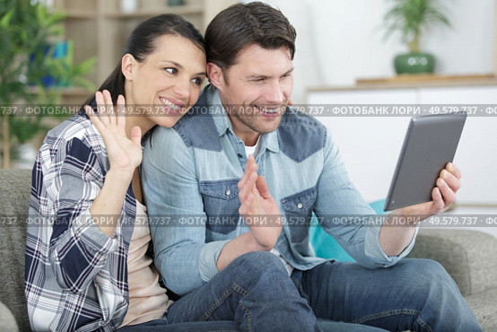 young attractive couple having online video chat. Стоковое фото, агентство Ingram Publishing / Фотобанк Лори