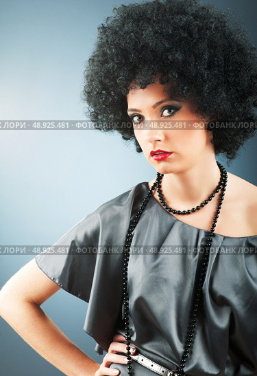Young attractive girl with afro curly haircut. Стоковое фото, агентство Ingram Publishing / Фотобанк Лори