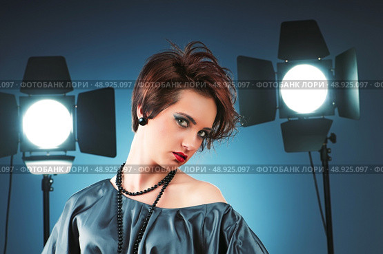 Young attractive girl with in the studio shooting. Стоковое фото, агентство Ingram Publishing / Фотобанк Лори