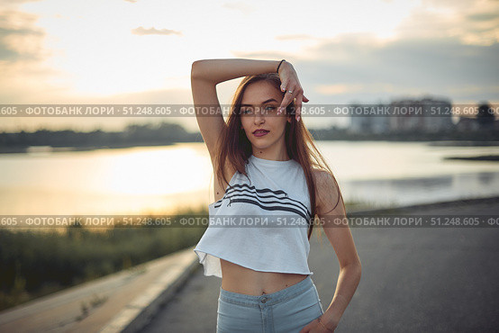 Young beautiful caucasian blonde girl listening to music with smartphone walking and dance in the city with headphones smiling - relax, youth, emancipation concept. Стоковое фото, фотограф Арзюков Вадим Николаевич / Фотобанк Лори