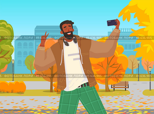 Young guy doing live streaming in autumn park. Video blogging concept. Social media network blogger. Man is broadcasting live with his smartphone. Person uses technology for video blog and broadcast. Young guy is doing live streaming in autumn park. Man is broadcasting with his smartphone. Стоковая иллюстрация, агентство Ingram Publishing / Фотобанк Лори