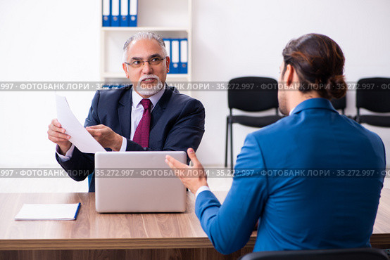 Young male candidate employee meeting with old recruiter. Стоковое фото, фотограф Elnur / Фотобанк Лори