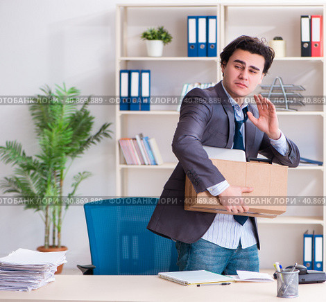 Young male employee being fired from his work. Стоковое фото, фотограф Elnur / Фотобанк Лори