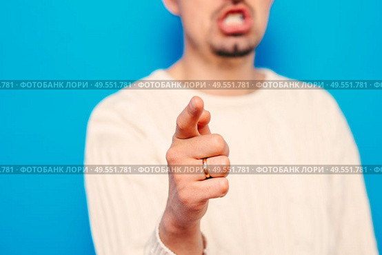 Young man showing his index finger towards the camera. Стоковое фото, агентство Ingram Publishing / Фотобанк Лори