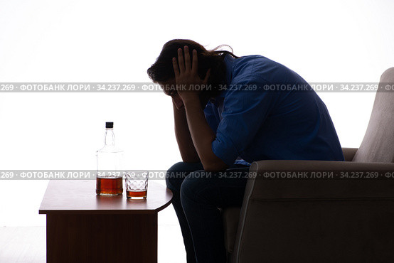 Young man suffering from alcoholism. Стоковое фото, фотограф Elnur / Фотобанк Лори