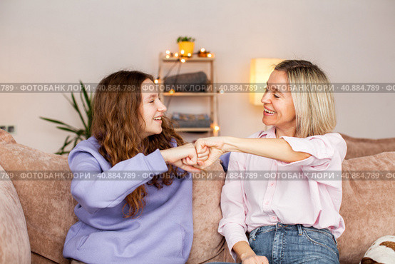 Young mother chatting with teen daughter together at home. Стоковое фото, фотограф Гладских Татьяна / Фотобанк Лори