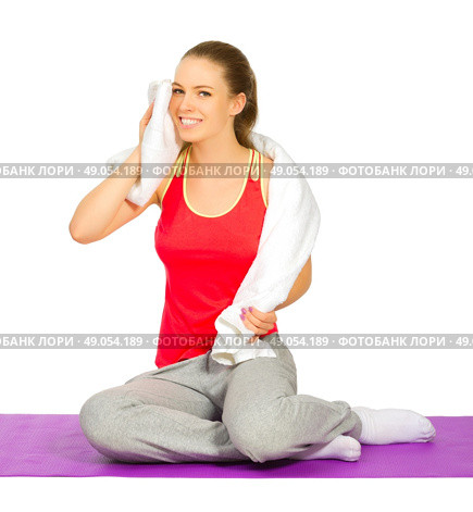 Young sporty girl doing gymnastic exercises isolated. Стоковое фото, агентство Ingram Publishing / Фотобанк Лори