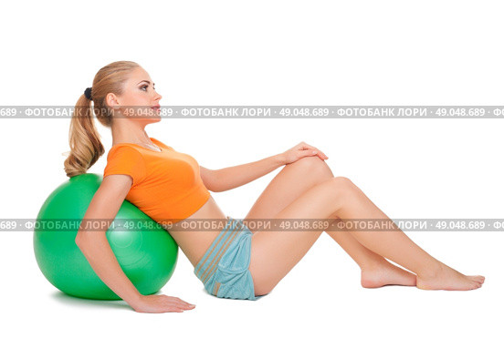 Young sporty woman with gymnastic ball. Стоковое фото, агентство Ingram Publishing / Фотобанк Лори