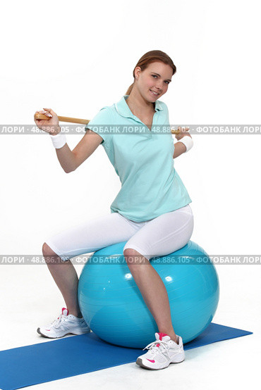 Young woman with an exercise ball. Стоковое фото, агентство Ingram Publishing / Фотобанк Лори
