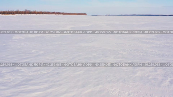 Западная Сибирь: река Обь зимой. Вид с воздуха. Western Siberia: the Ob River in winter. Aerial view. Стоковое видео, видеограф Евгений Романов / Фотобанк Лори